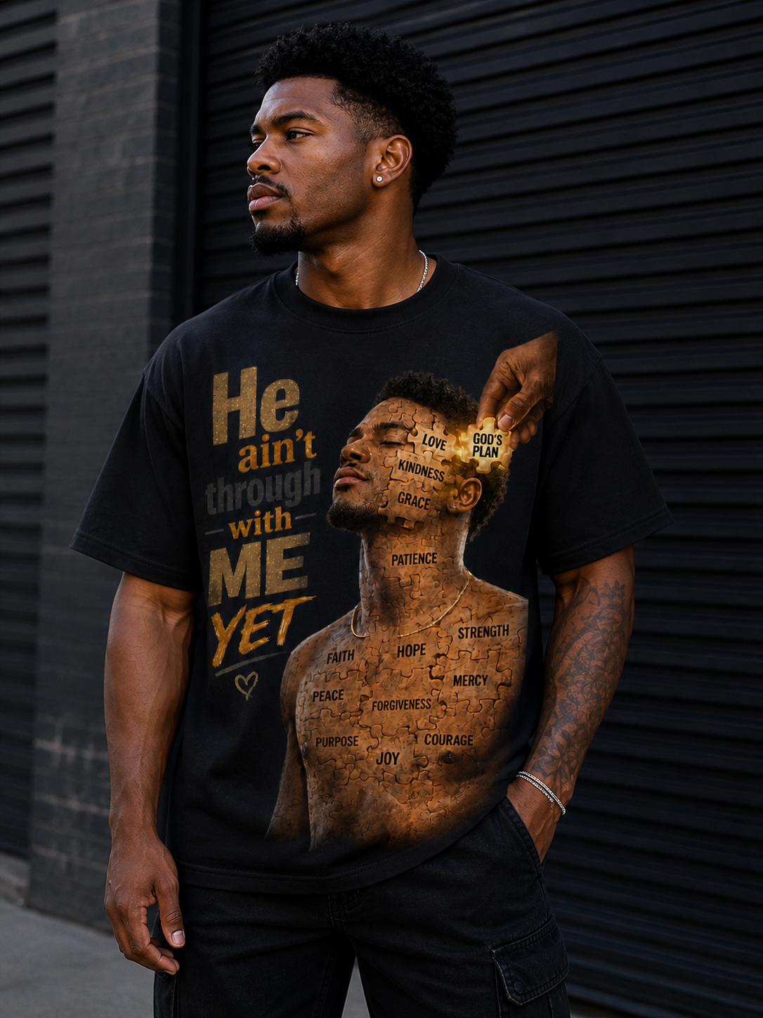 he ain’t through with me yet tee (male) he ain’t through with me yet tee (male)
